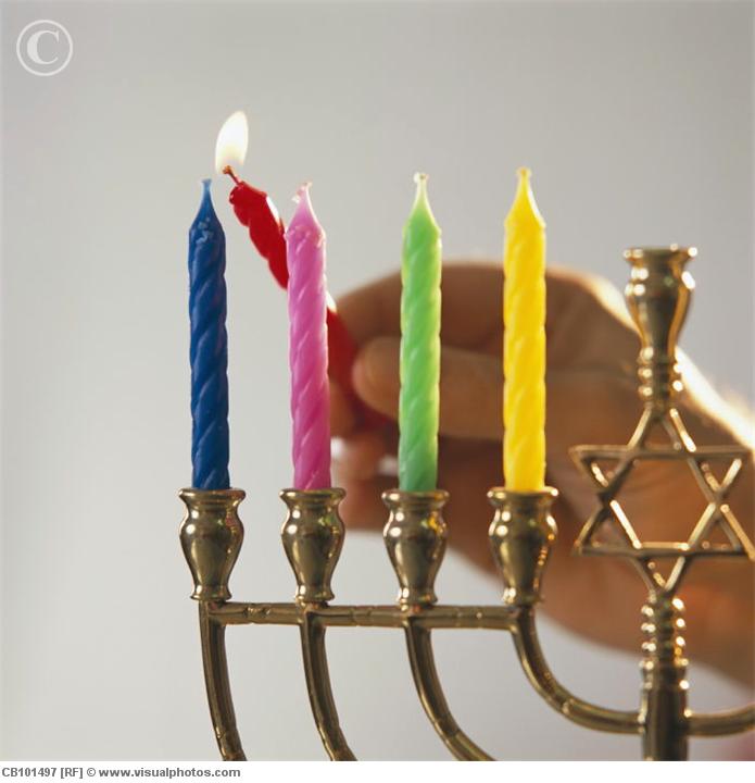 lighting_menorah_candles_for_hanukkah_cb1014971.jpg