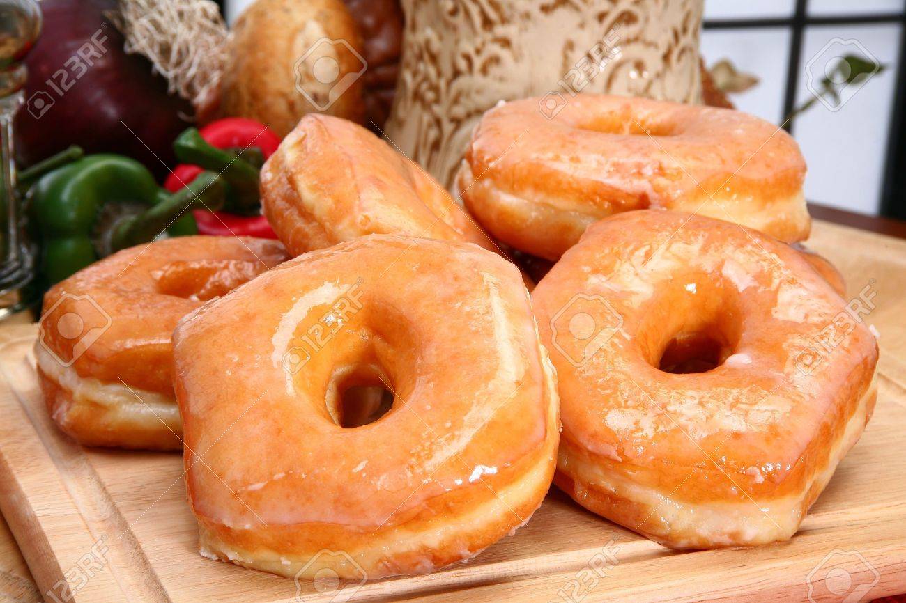 3019802-Stack-of-fresh-baked-glazed-donuts-in-kitchen-or-restaurant--Stock-Photo.jpg