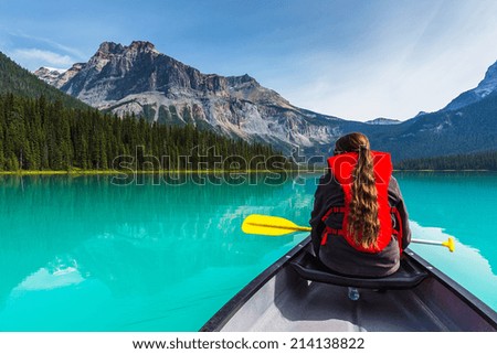 stock-photo-canoeing-on-emerald-lake-in-summer-at-the-yoho-national-park-alberta-canada-214138822.jpg