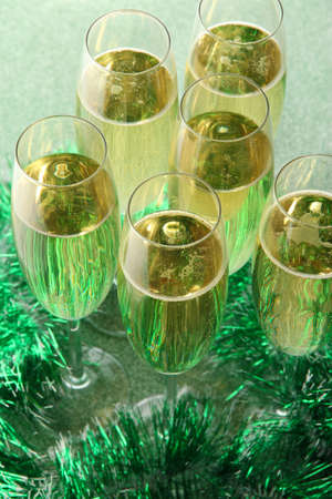 24362254-glasses-with-champagne-on-shiny-background.jpg
