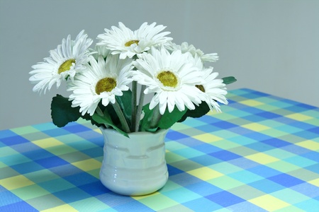 10181296-white-artificial-flower-bouquet-for-autumn-and-winter-image-background-on-sweet-table.jpg