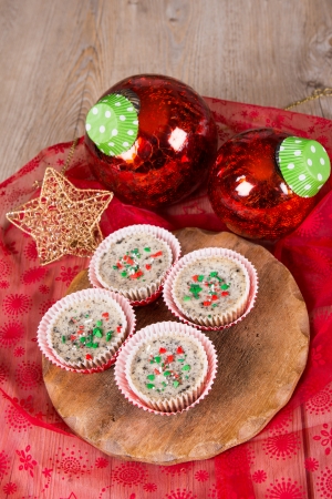 22425035-christmas-dessert-mini-cookies-and-cream-cheesecakes-in-muffin-forms-with-red-christmas-tree-balls.jpg