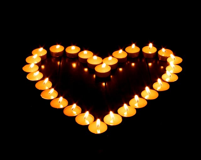 lit-candles-in-heart-shape-romantic-candle-light-photos-92789.jpg