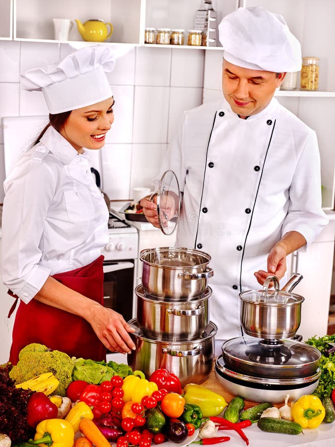 man-chef-hat-cooking-chicken-happy-men-women-professional-kitchen-67192337.jpg
