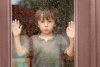 little-boy-behind-window-rain-looking-sad-57101629.jpg