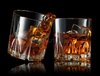 glasses-whiskey-making-toast-splashes-black-background-171943212.jpg