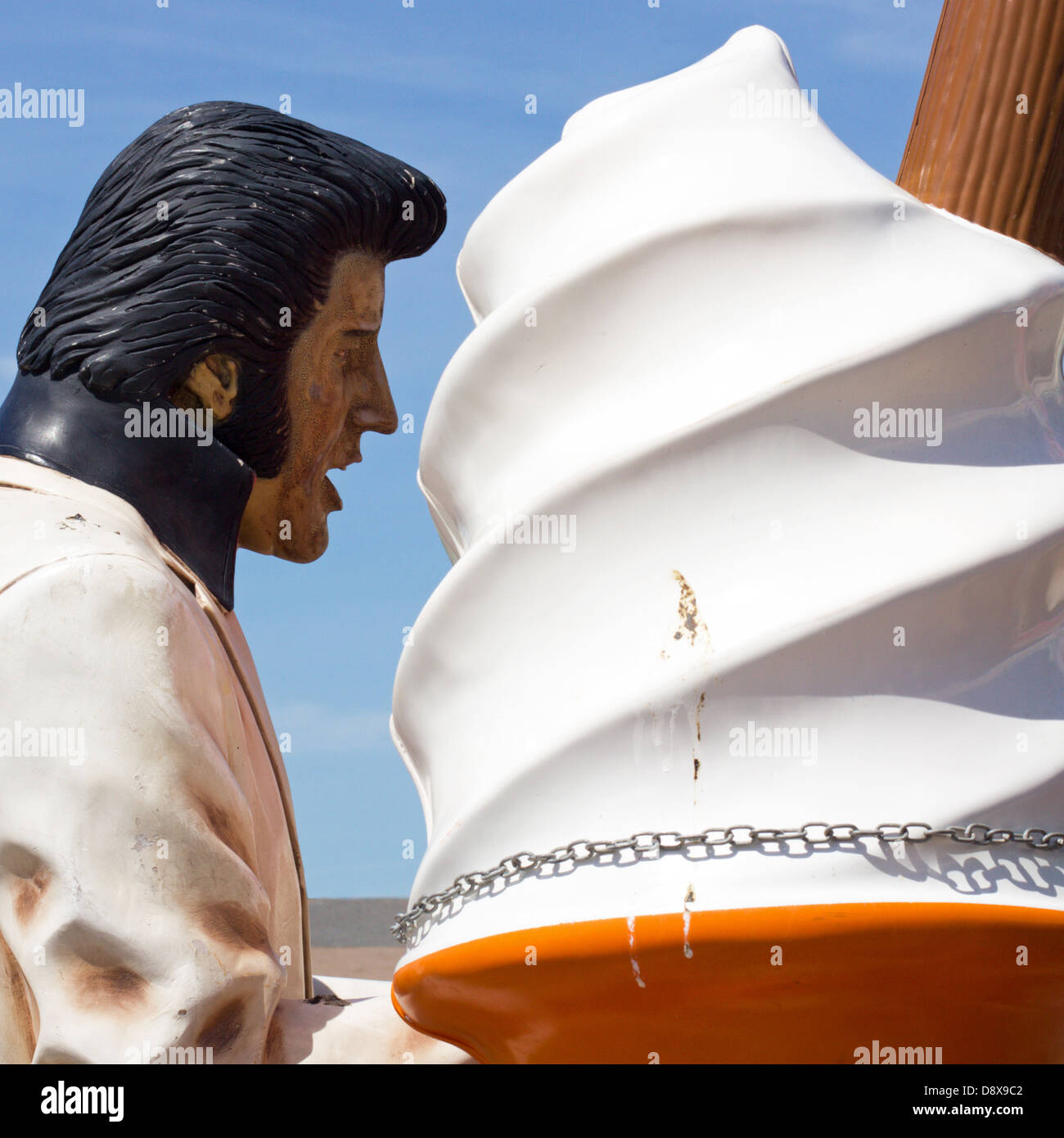 giant-elvis-mannequin-looks-like-he-is-eating-a-giant-ice-cream-cone-D8X9C2.jpg