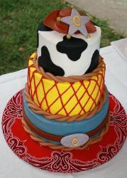 Three+tier+cowboy+theme+cake+with+hat+and+belt+buckle.JPG