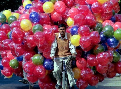 images_funny_man_riding_bicycle_with_balloons.jpg
